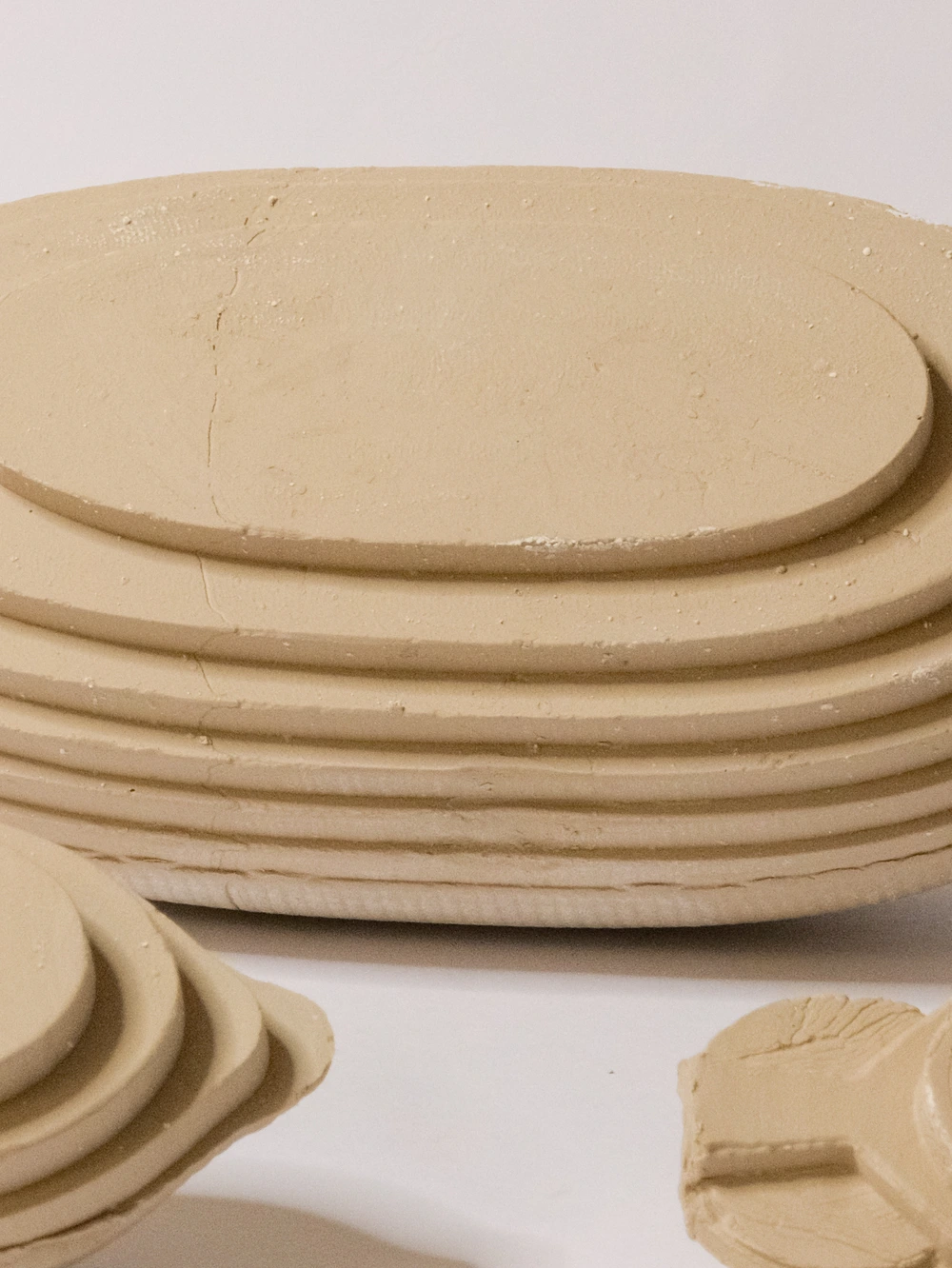 Close detail of the stepped clay surfaces of Amphora